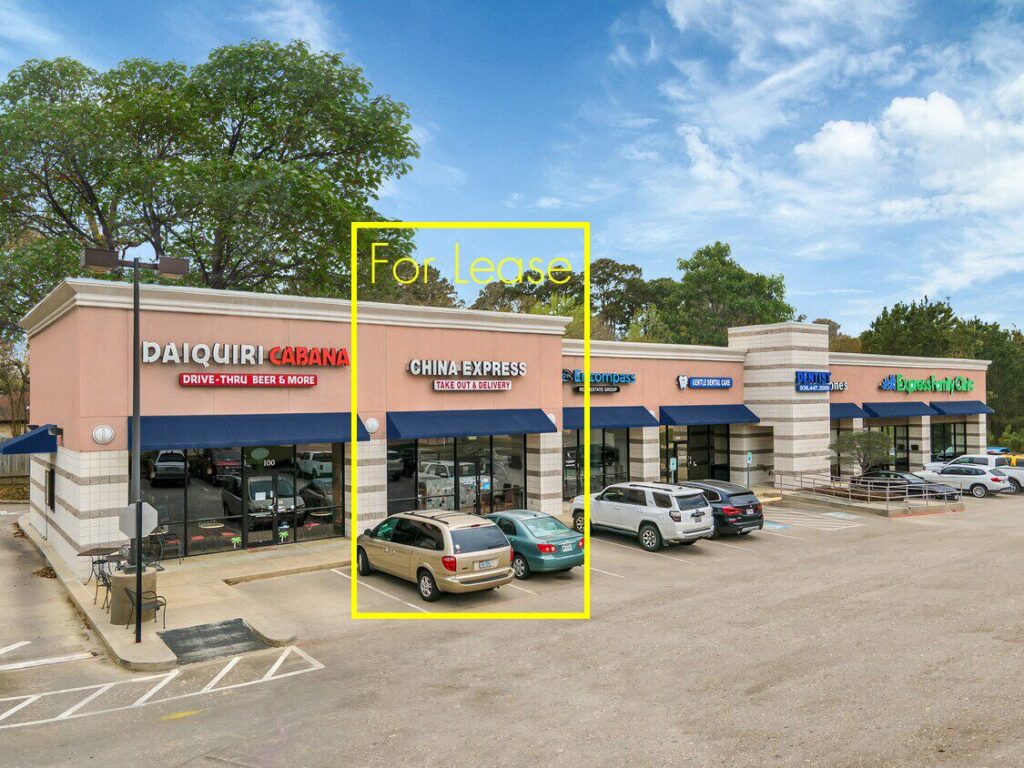 Retail shopping strip with lines marking space available 